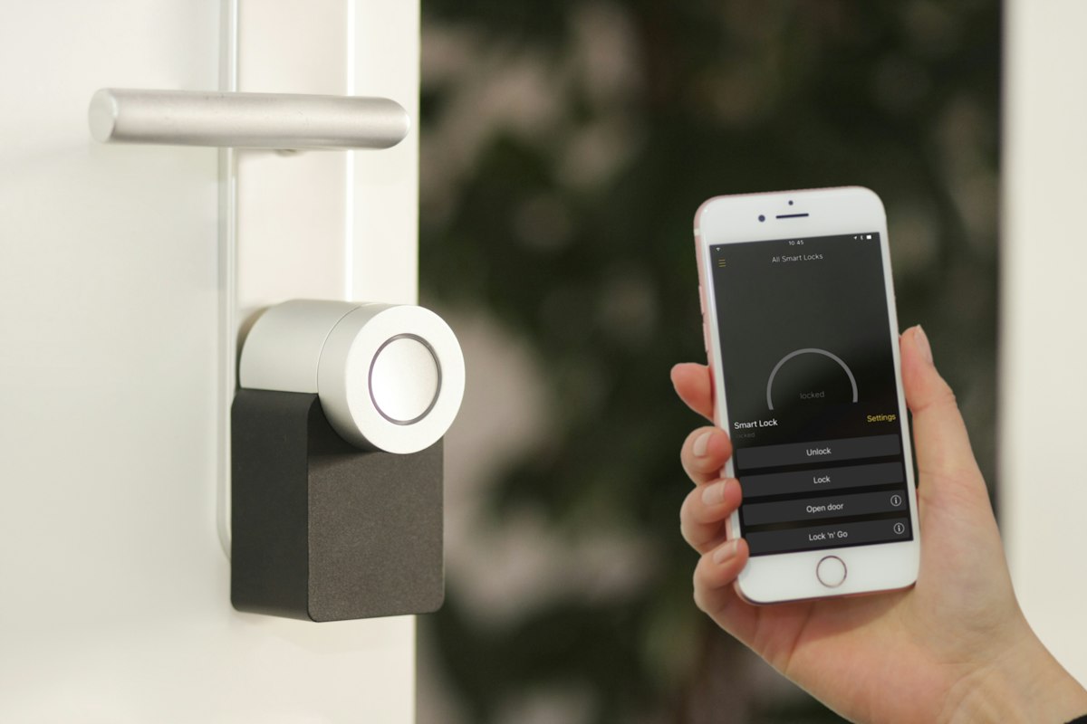 Smart high-definition video doorbell mounted on modern architectural entry door frame