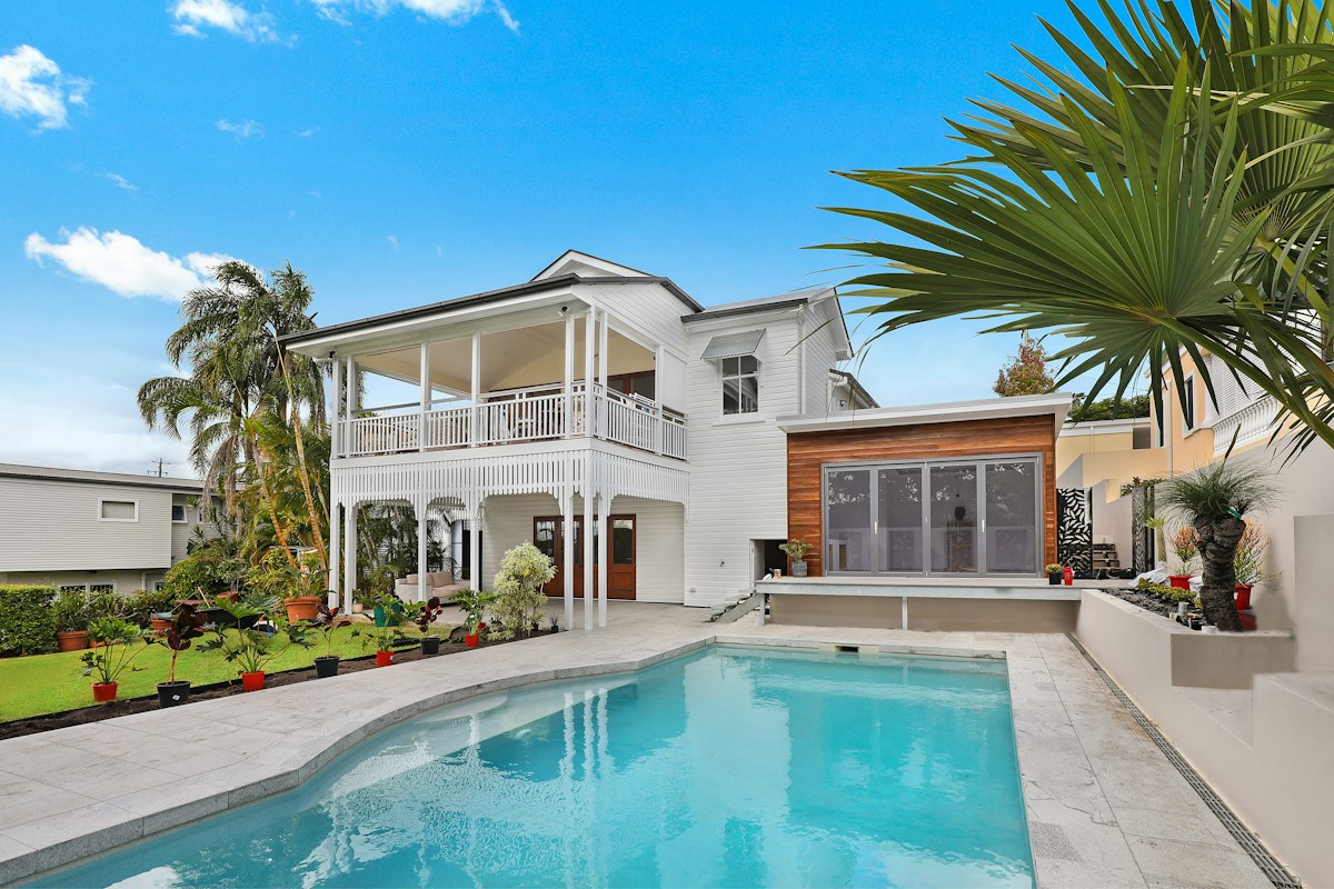 Craftsman single-family home exterior with well-maintained foundation and architectural roof